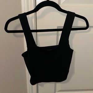 This is a small and black American eagle tank top